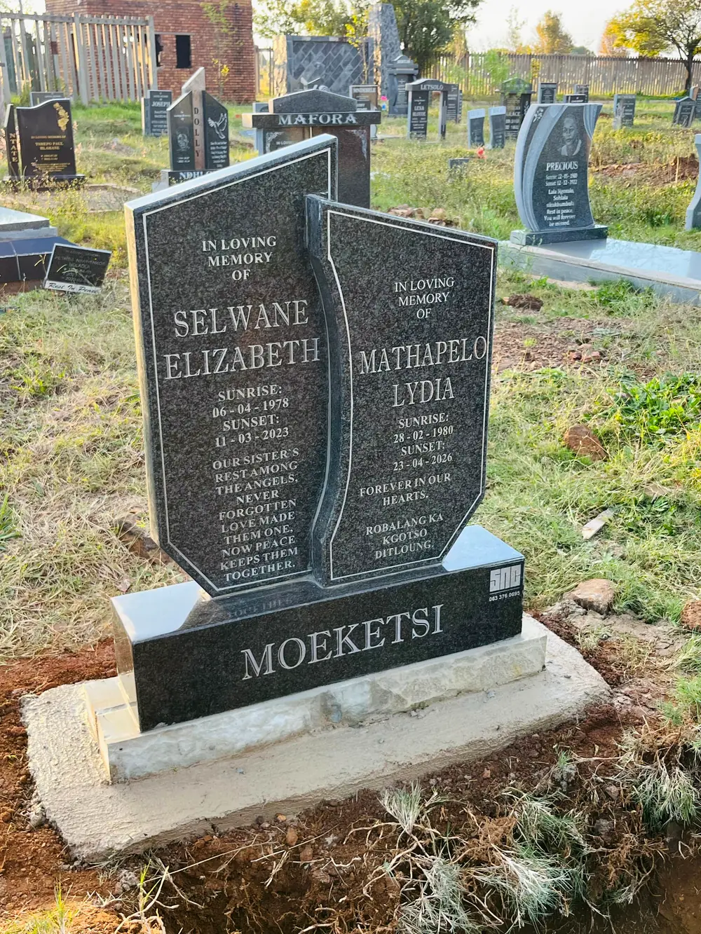 Double granite headstone for a couple